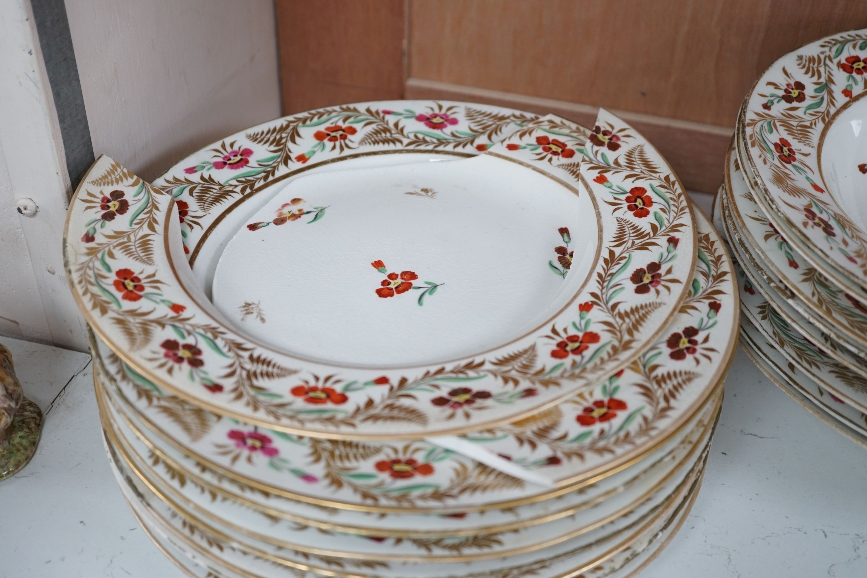 An early 19th century Derby seventeen-piece part dinner set, lobed oval serving dishes 31cm.